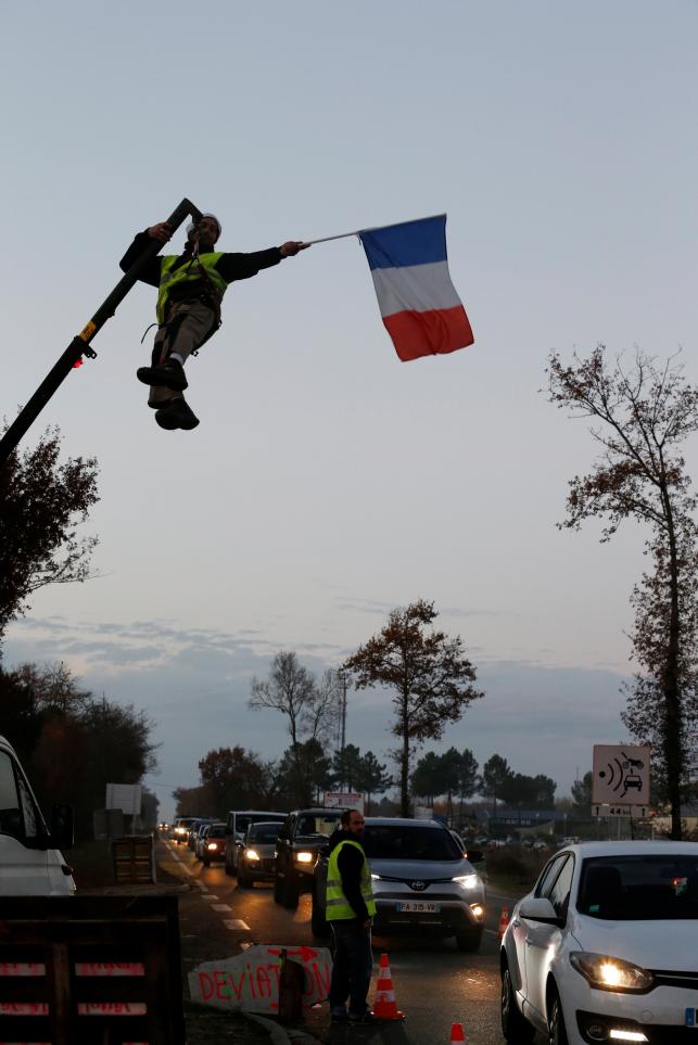 France scraps fuel price hikes after weeks of protest