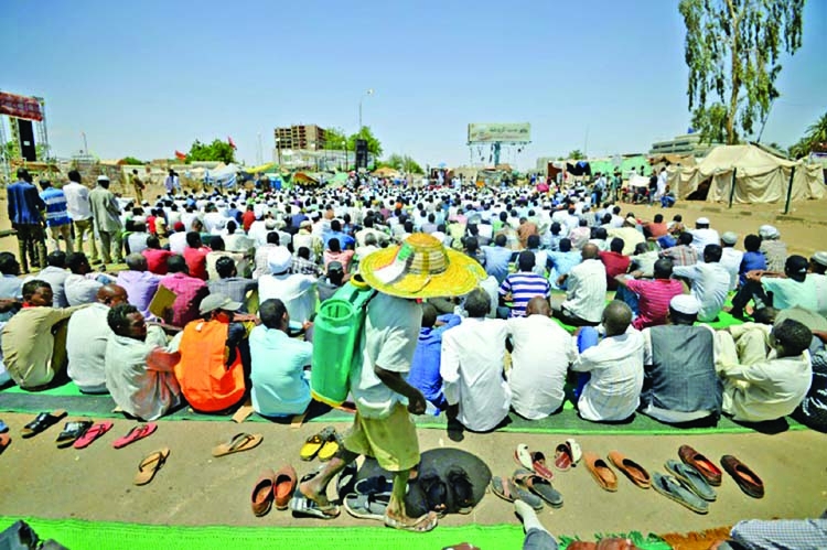 Sudan protesters tear down roadblocks, want army to resume talks