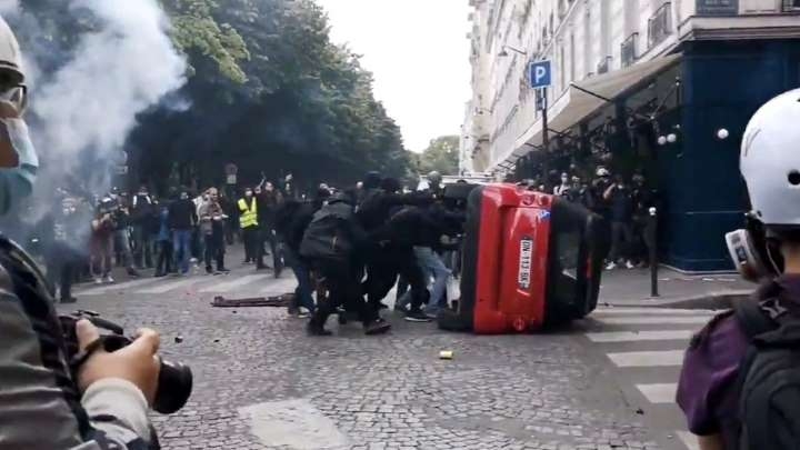 Violence erupts in Paris rally for well being workers