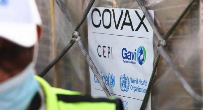 World’s first Covax jab injected as US eyes J&J rollout