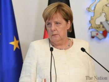 Merkel  condemns 'hunt' against foreigners