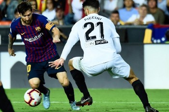 Barca held 1-1 at Valencia