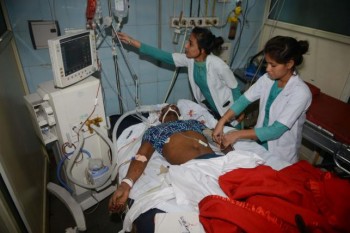 At least 59 killed as train hits crowd in India