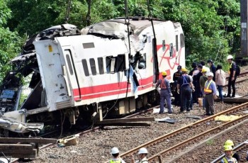 Rescuers search site after train crash killed 18 in Taiwan