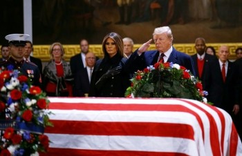 Trump pays respects as Bush lies in state