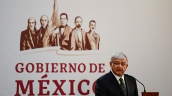 Mexican president declares few assets, shows bare wallet