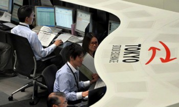 Tokyo stocks open higher on cheaper yen