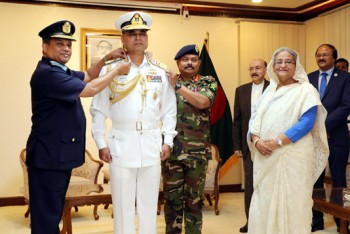 Navy chief adorned with admiral rank