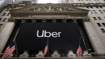 Uber shares sink on stock market debut