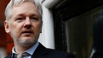 Assange suffering psychological torture, would face "show trial" in US