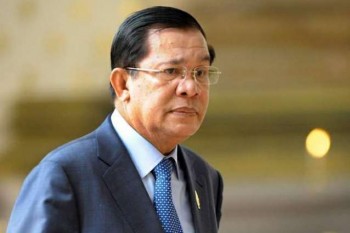Cambodia PM visits deadly building collapse site