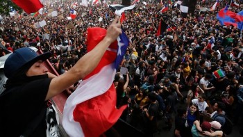Chile leader moves eight ministers after protests