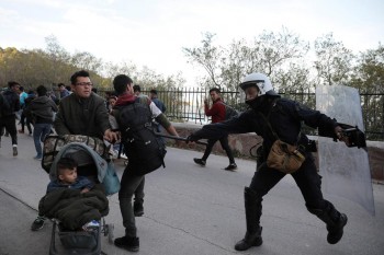 Greek troops fire tear gas at migrants