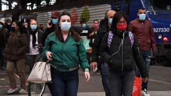 French shops reopen but masks widely required