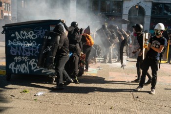 Protesters clash with Seattle police in latest outcry over US feds