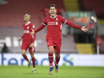 Firmino sends Liverpool to top