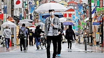 Japan’s growth forecast cut as new pandemic curbs hit