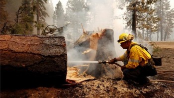 Firefighters tackle historic California wildfire