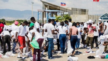 Angry scenes at Haiti airport as migrants arrive
