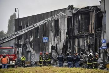 Eight killed as plane crashes into Milan building