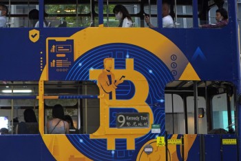 Bitcoin tops $66,000, sets record as crypto goes mainstream