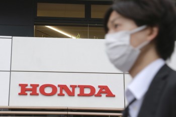 Honda lowers profit, vehicle sales forecast over chip crunch