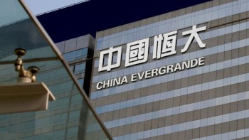 Evergrande shares slip after deal to raise $273 million in a business sale