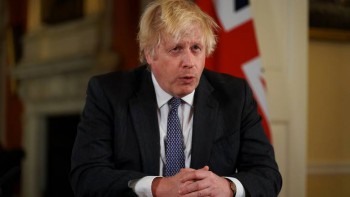 UK's Boris Johnson brings forward booster target amid Omicron ‘tidal wave’