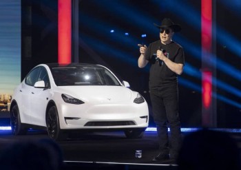 Musk says Tesla will build vehicle designed to be a robotaxi