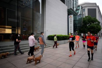 Shanghai revives after two-month COVID lockdown, wary of a new one
