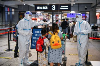China customs drops some COVID reporting for international arrivals; quarantine remains