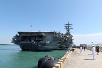 U.S. stages carrier drills, announces new sanctions, after N Korea missile launches