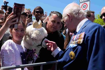 King Charles greets happy crowds, an angry MP and an alpaca on visit to Canberra